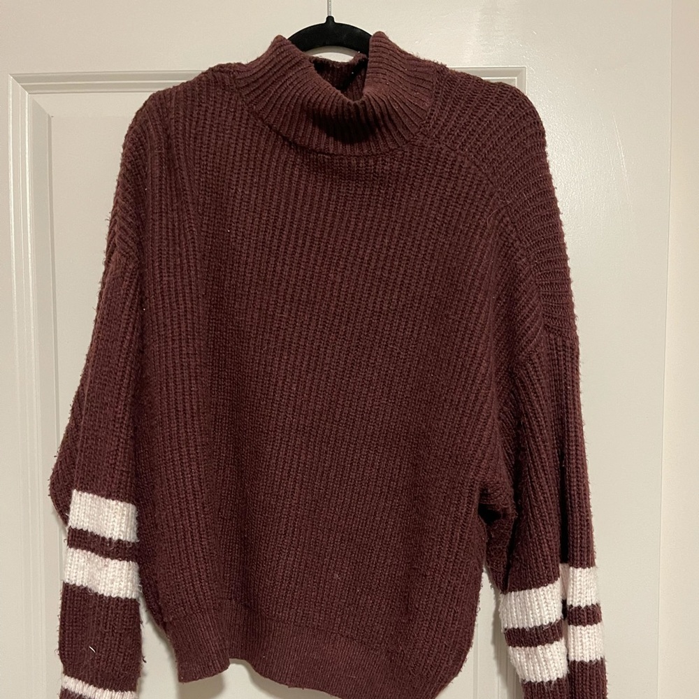 Really soft maroon express sweater. Gently used. It’s a large.